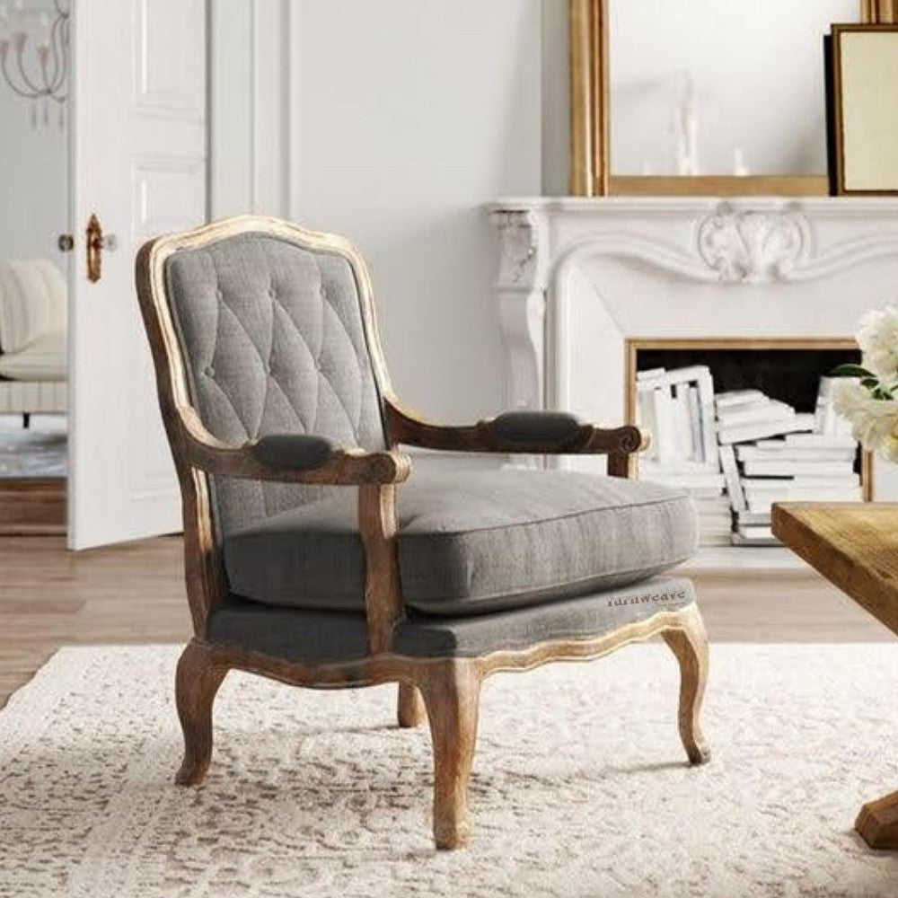 Modern meets timeless in this elegant Grey Wooden Carved Arm Chair. Crafted from solid wood, its intricate carvings whisper tales of artistry, while the plush cushions promise hours of comfortable relaxation.